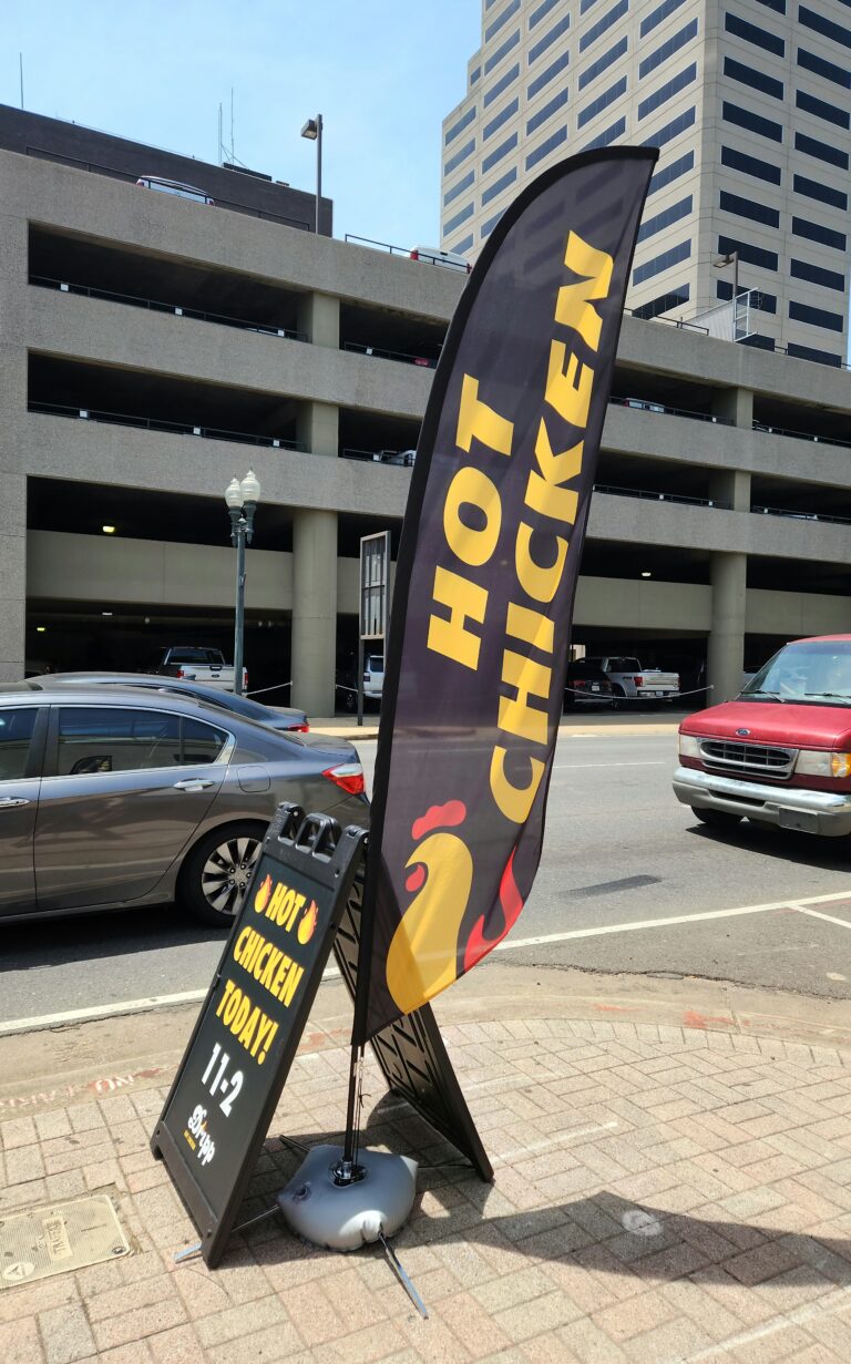 Dripp hot chicken feather flag and A frame plastic sign